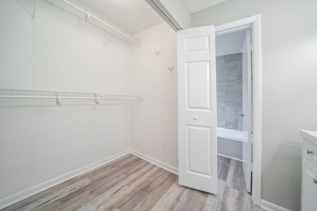 12969 Pennypacker Trail, Unit 15 Wellington, FL 33414 - Photo 7 of 24 a view of an empty walk in closet