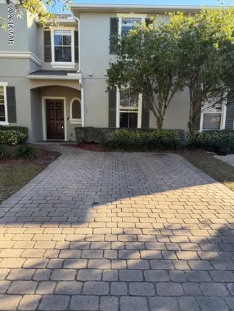 a view of white house with a yard