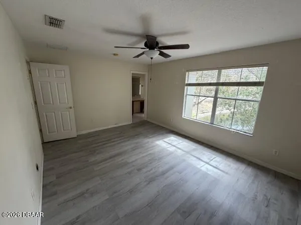 a view of a kitchen with a sink and cabinets