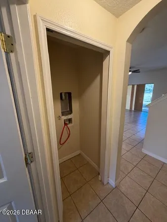 a kitchen with stainless steel appliances kitchen island granite countertop a refrigerator and a sink