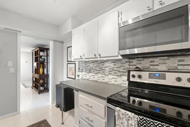 a kitchen with a stove and a microwave
