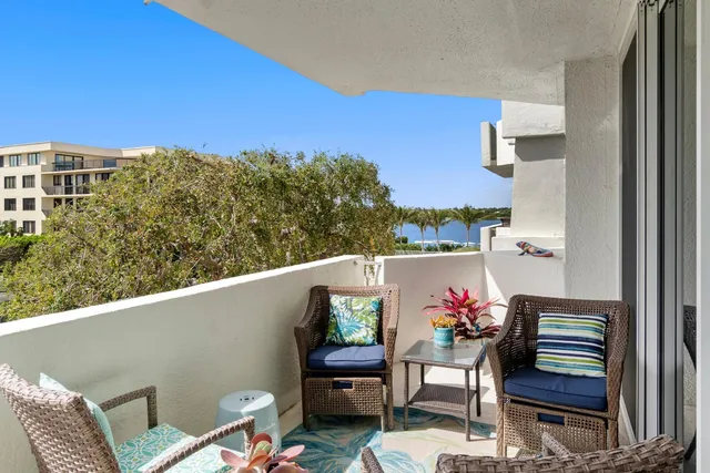 a view of a balcony with chairs