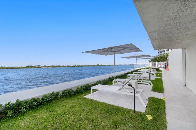 swimming pool view with a seating space