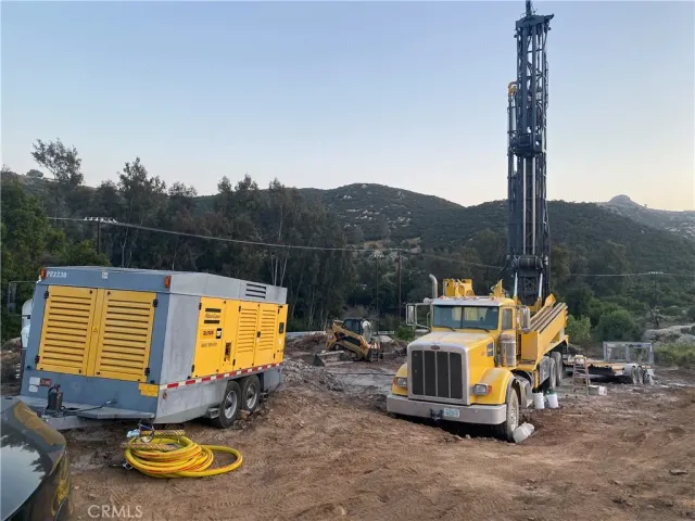a view of a swimming pool with a patio and a garden
