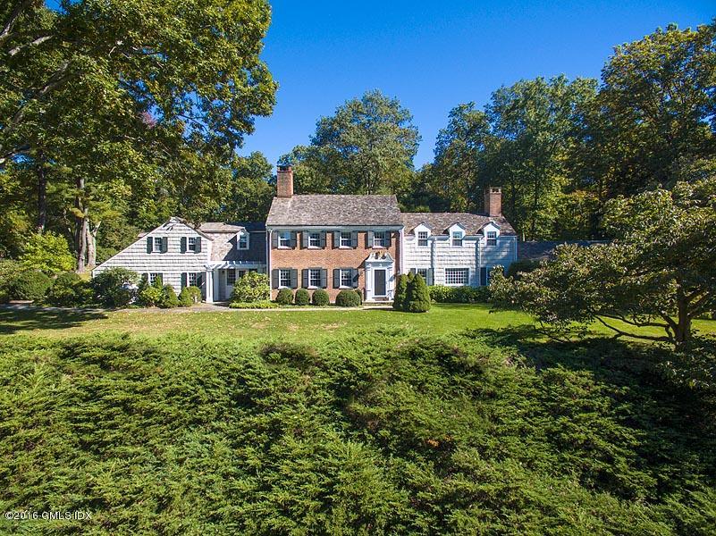 295 Round Hill Road Greenwich, CT 06831 - Photo 1 of 14 a house view with a garden space