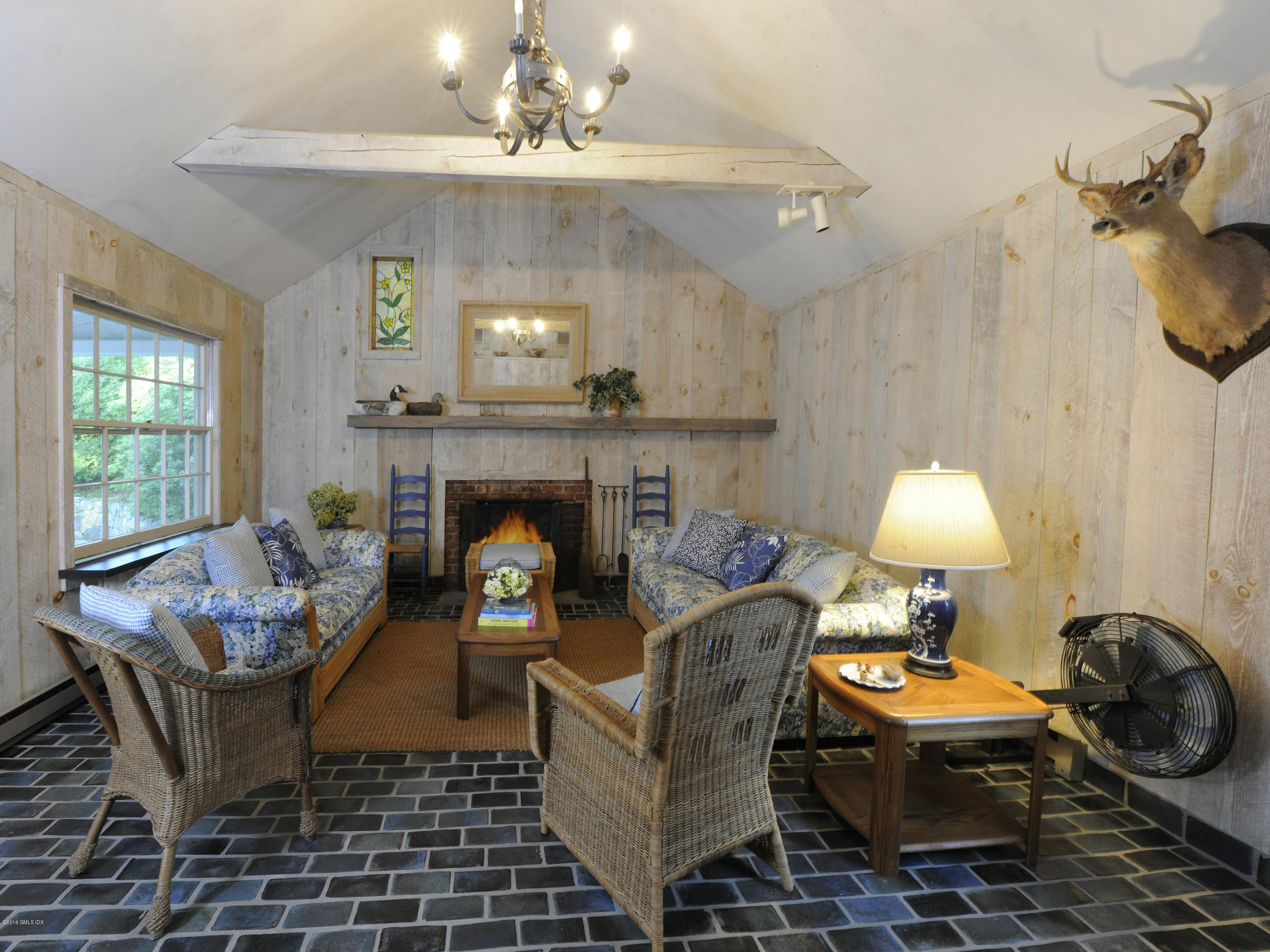 295 Round Hill Road Greenwich, CT 06831 - Photo 14 of 14 a living room with furniture and a fireplace
