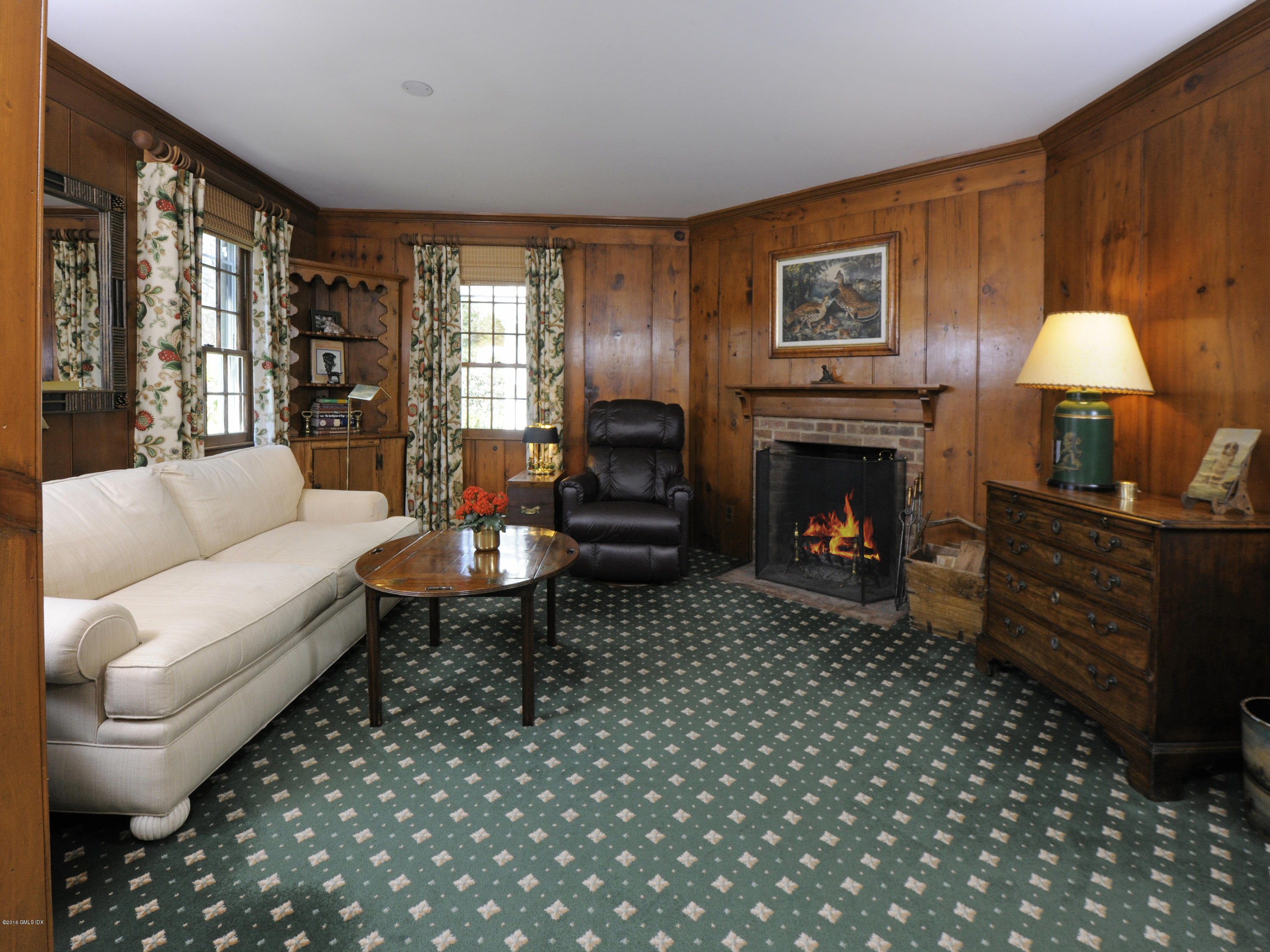 295 Round Hill Road Greenwich, CT 06831 - Photo 6 of 14 a living room with furniture and a fireplace