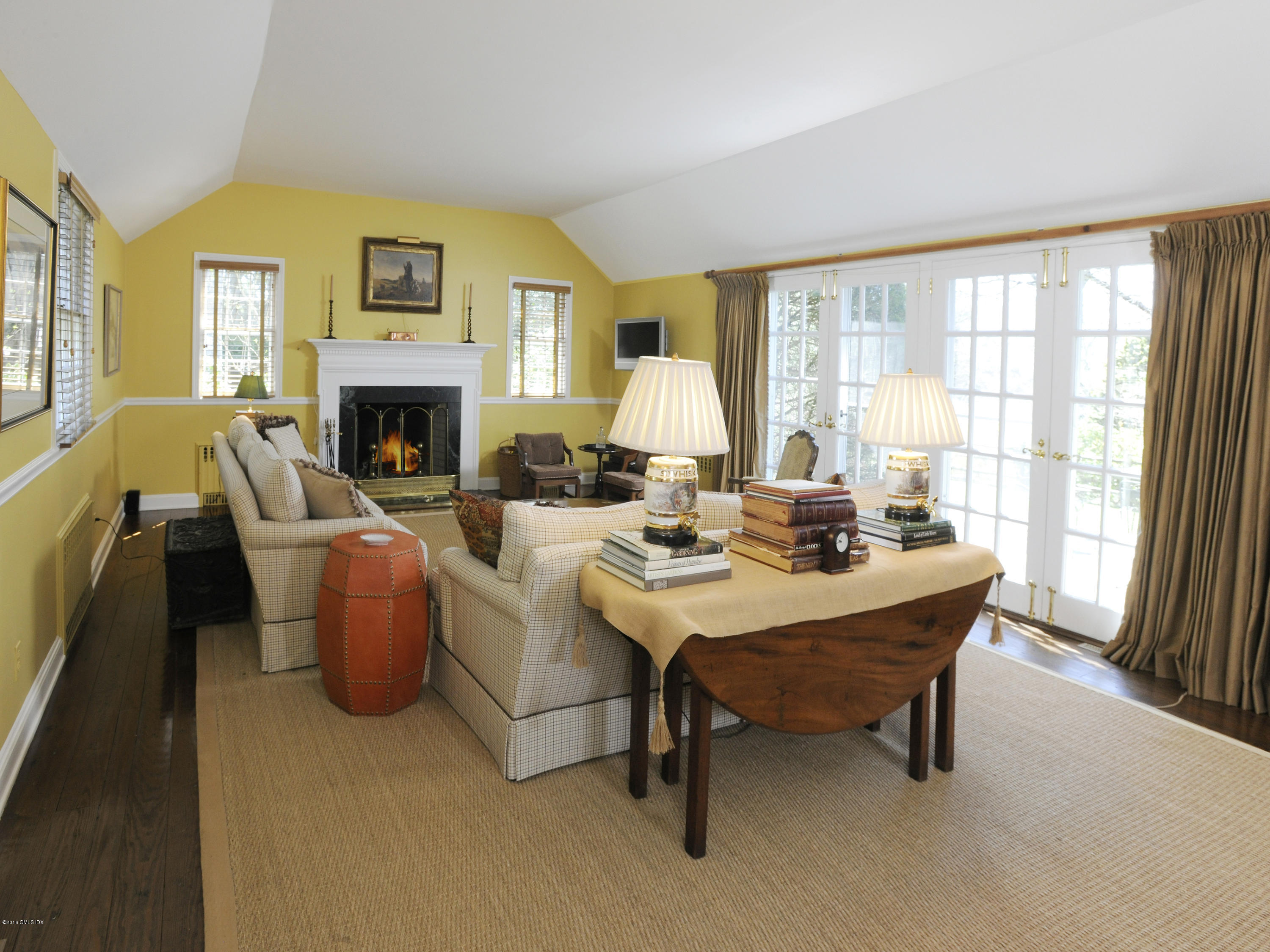295 Round Hill Road Greenwich, CT 06831 - Photo 7 of 14 a living room with furniture and a fireplace
