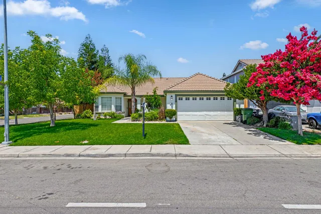 a view of front a house and a yard