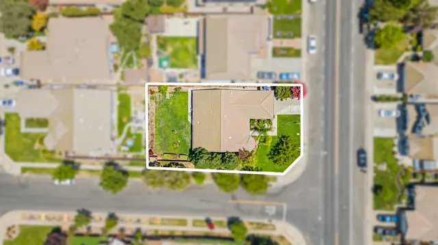 a view of a swimming pool with a yard