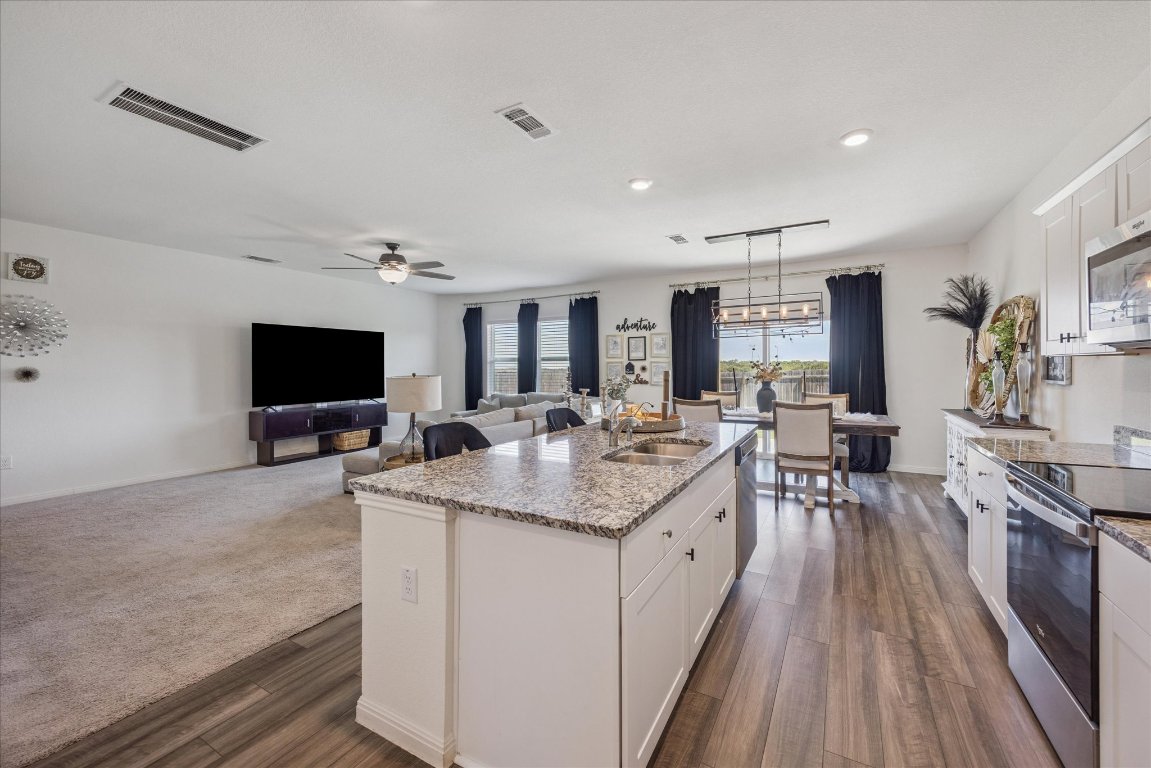 208 Night Riders Way Jarrell, TX 76537 - Photo 31 of 31 a large kitchen with sink and cabinets
