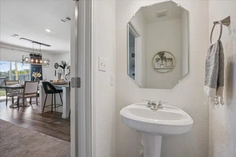 a kitchen with stainless steel appliances granite countertop a sink refrigerator and microwave