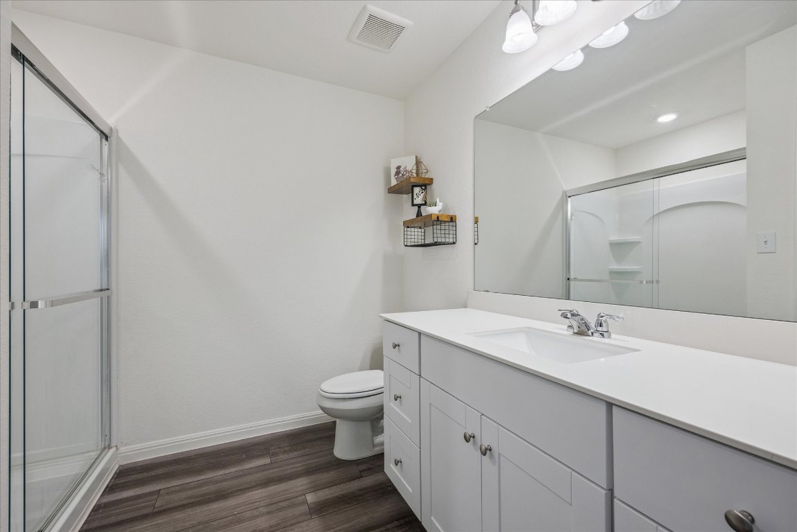 208 Night Riders Way Jarrell, TX 76537 - Photo 16 of 31 a bathroom with a sink a toilet and mirror