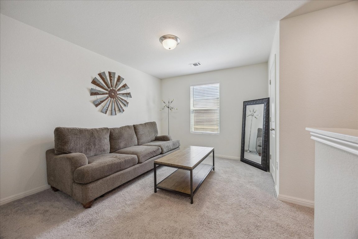 208 Night Riders Way Jarrell, TX 76537 - Photo 18 of 31 a living room with furniture and a window
