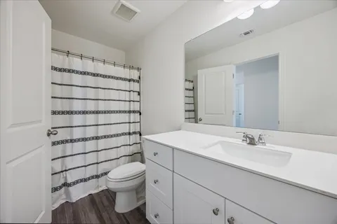 a bedroom with a bed and a table