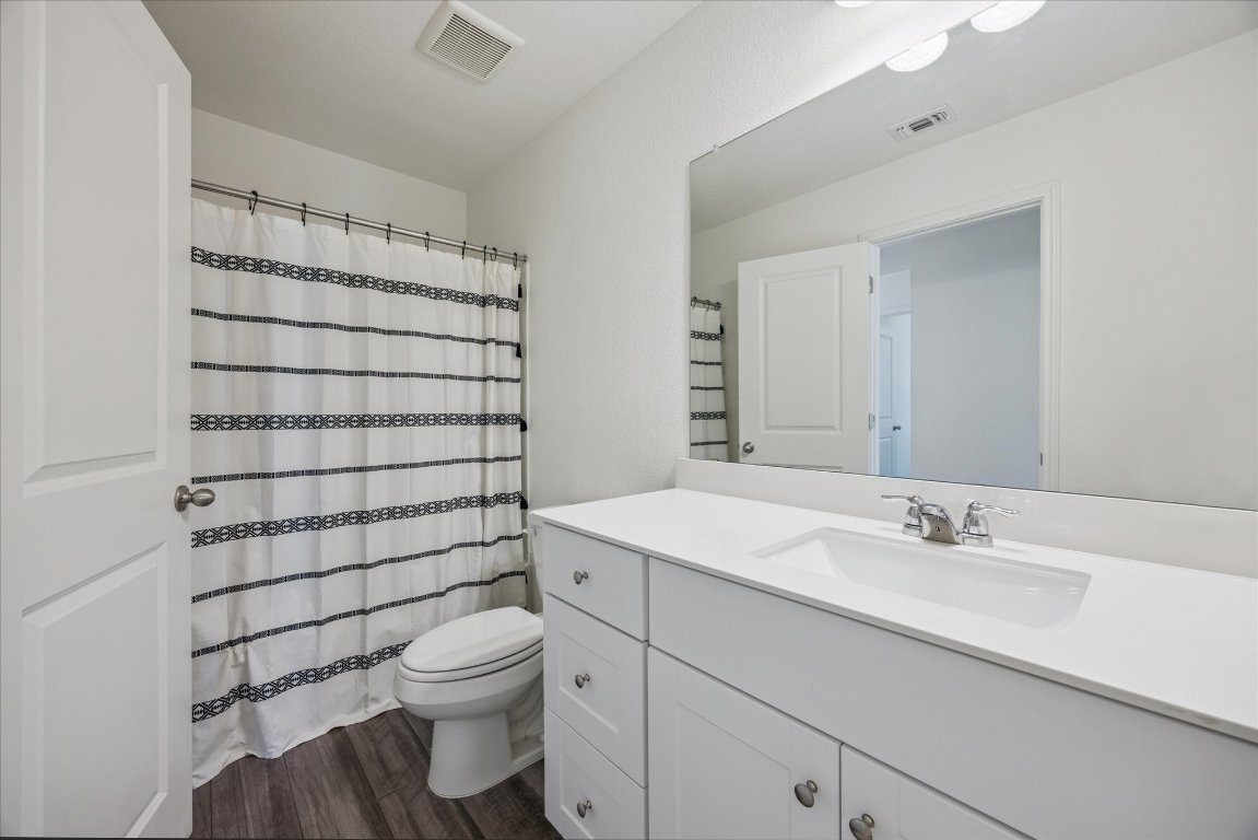 208 Night Riders Way Jarrell, TX 76537 - Photo 23 of 31 a bathroom with a sink toilet and shower