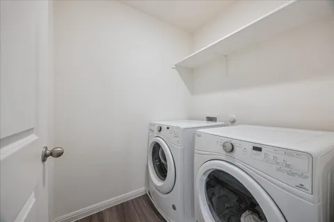 a bathroom with a glass shower door and a sink