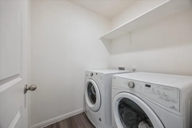 a bathroom with a glass shower door and a sink