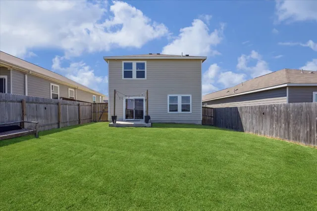 a view of a backyard with sitting area