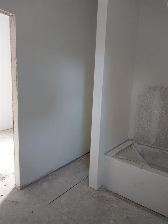 2859 Orange Street Marianna, FL 32448 - Photo 6 of 9 an empty room with a bathtub