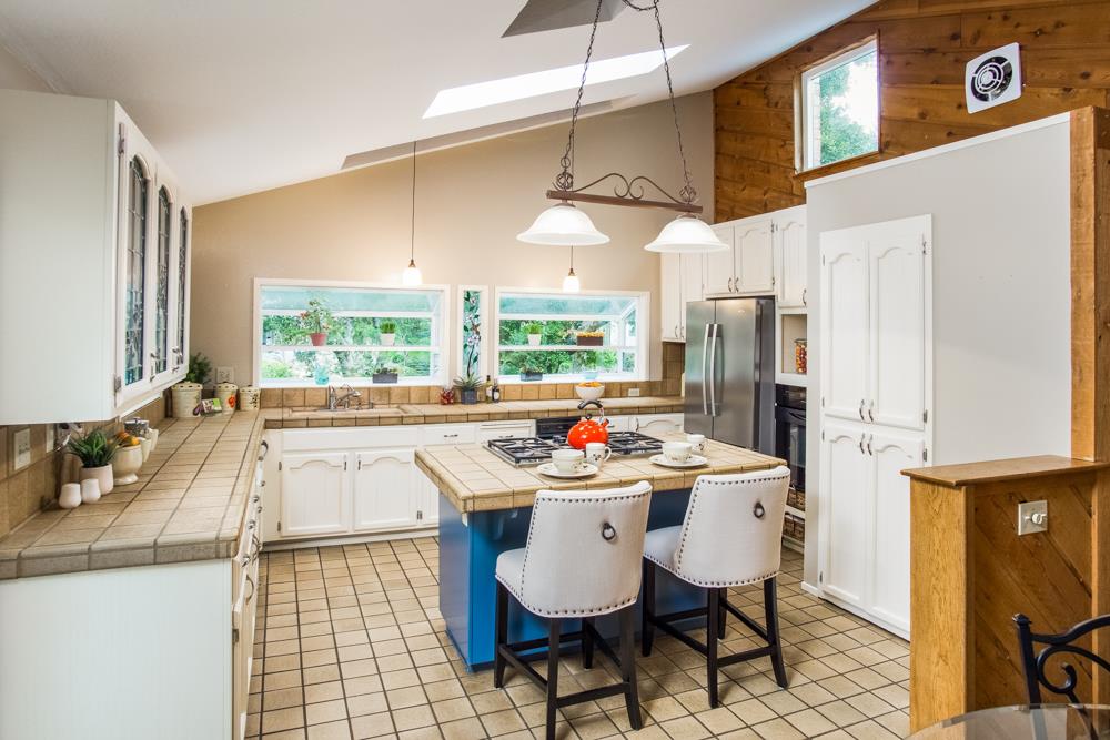 661 Sugar Pine Road Scotts Valley, CA 95066 - Photo 11 of 40 a kitchen with stainless steel appliances a sink a stove a table and chairs