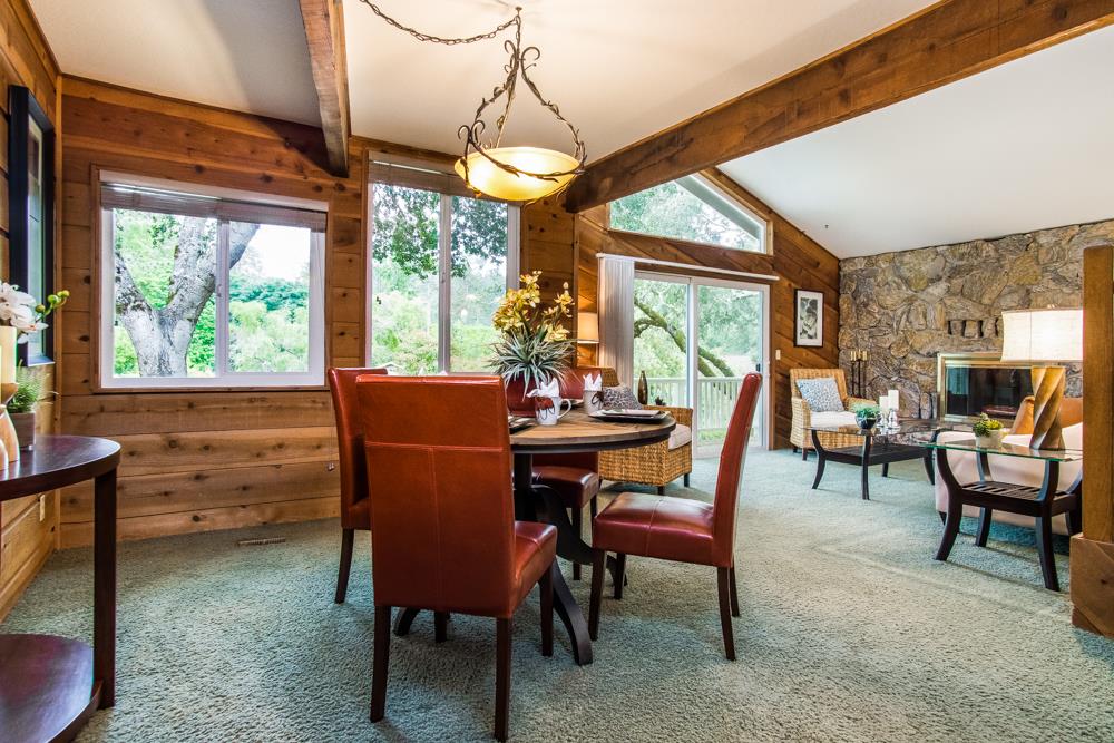 661 Sugar Pine Road Scotts Valley, CA 95066 - Photo 14 of 40 a dining room with furniture a chandelier and wooden floor