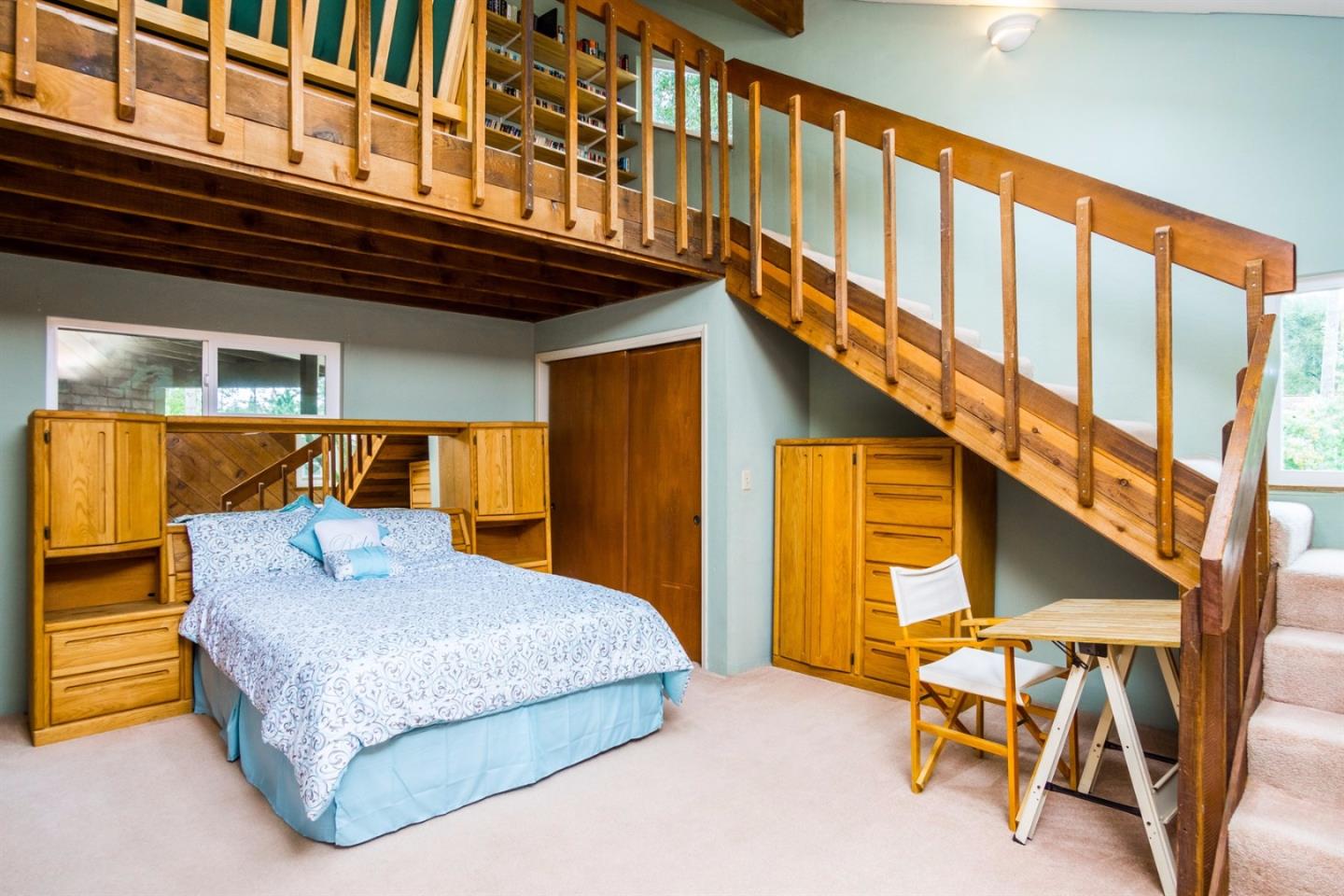 661 Sugar Pine Road Scotts Valley, CA 95066 - Photo 24 of 40 a bedroom with a bed and a chair