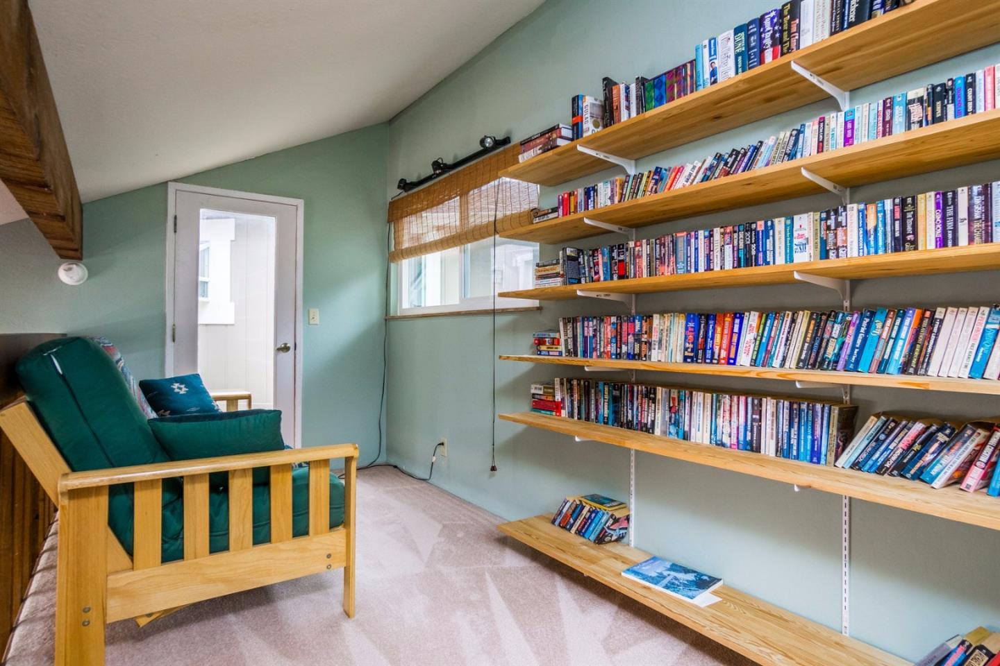 661 Sugar Pine Road Scotts Valley, CA 95066 - Photo 25 of 40 a living room with lots of books