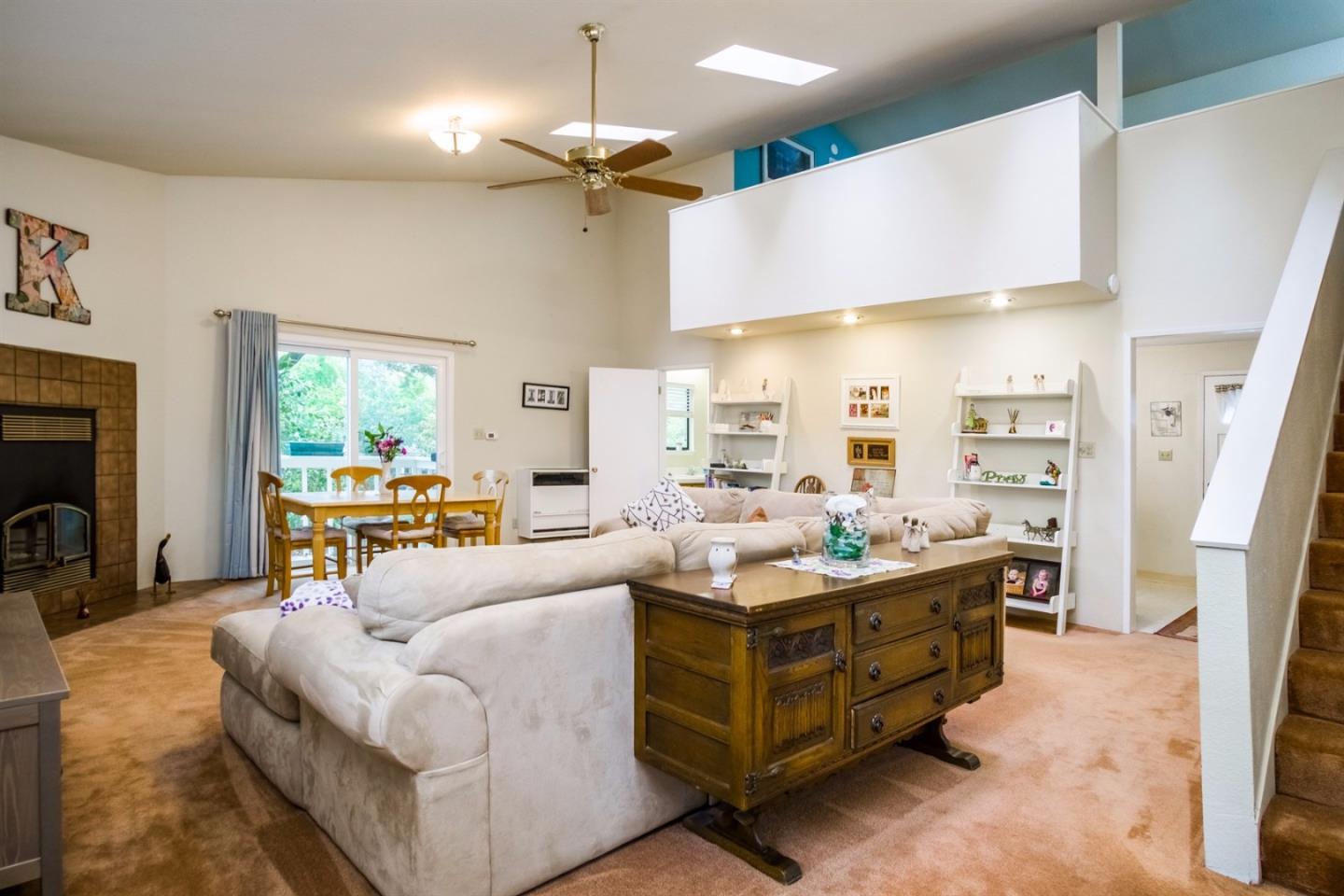 661 Sugar Pine Road Scotts Valley, CA 95066 - Photo 26 of 40 a living room with furniture fireplace and a large window