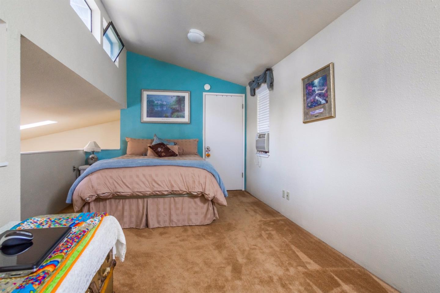 661 Sugar Pine Road Scotts Valley, CA 95066 - Photo 27 of 40 a bed room with a bed and a desk