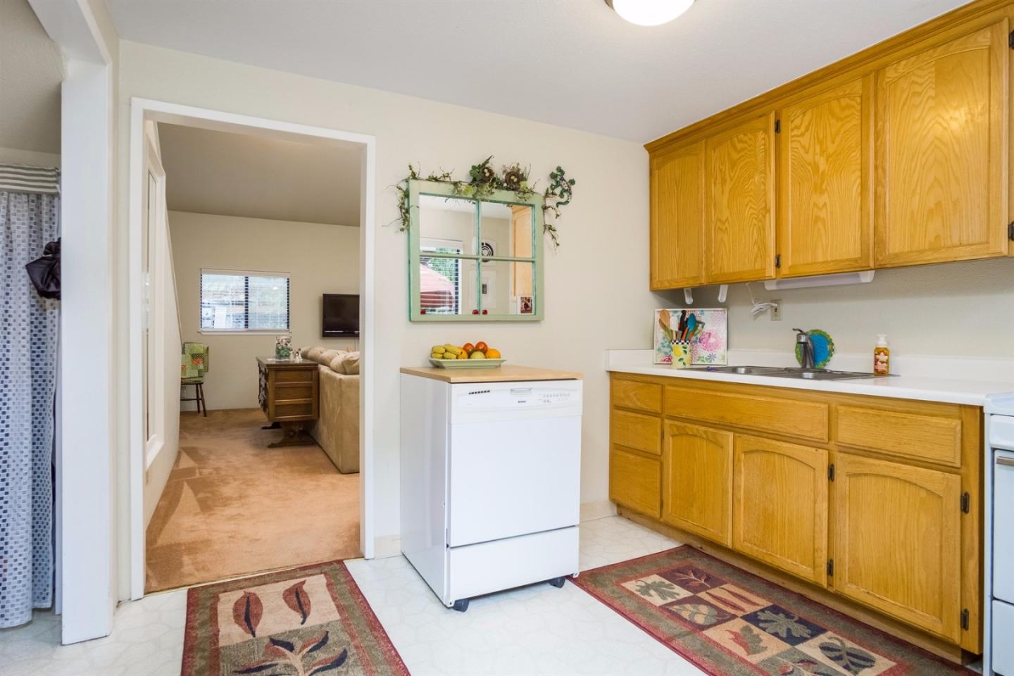 661 Sugar Pine Road Scotts Valley, CA 95066 - Photo 29 of 40 a kitchen with sink cabinets and appliances