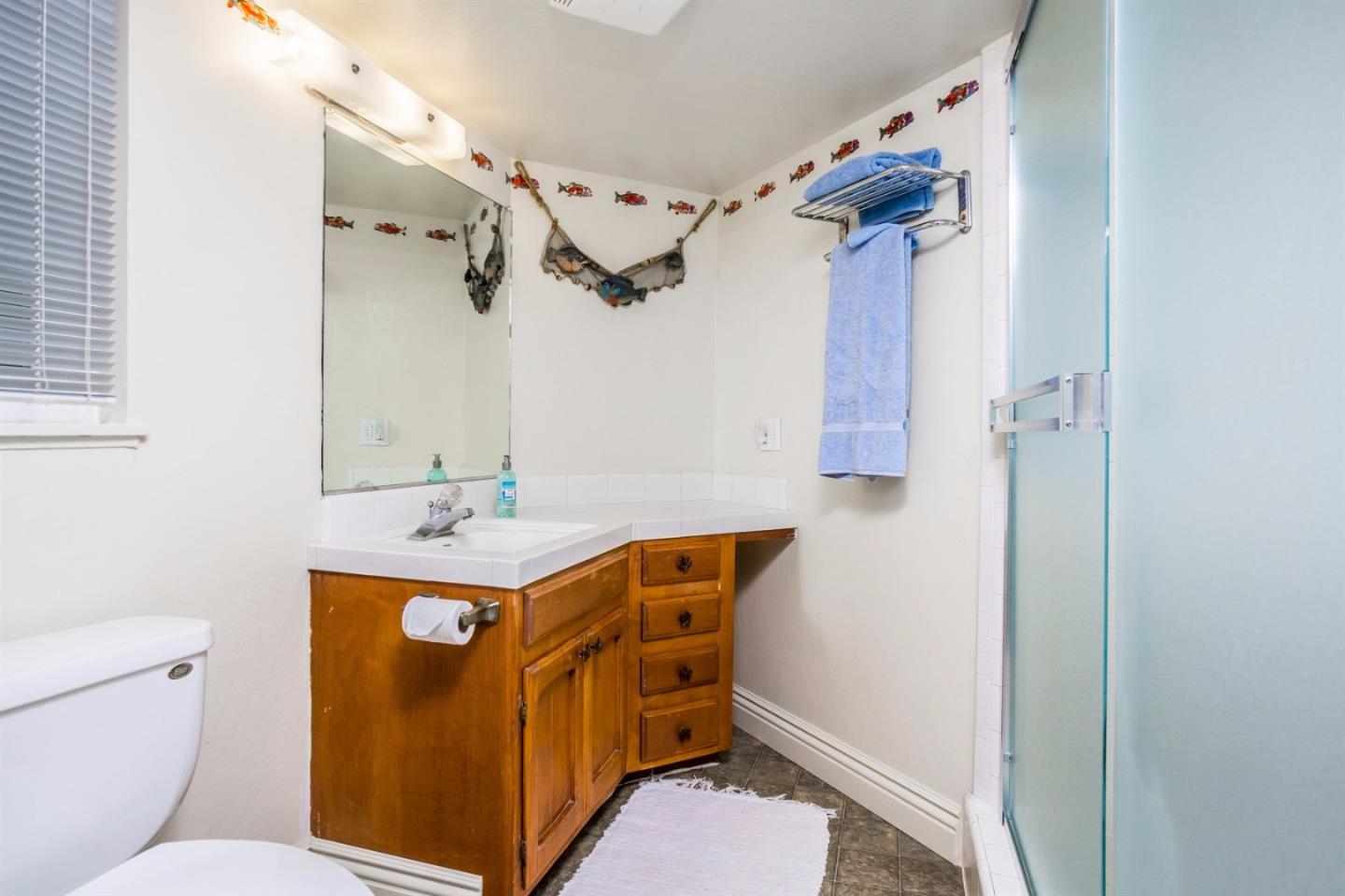 661 Sugar Pine Road Scotts Valley, CA 95066 - Photo 31 of 40 a view of bathroom with a table and a mirror