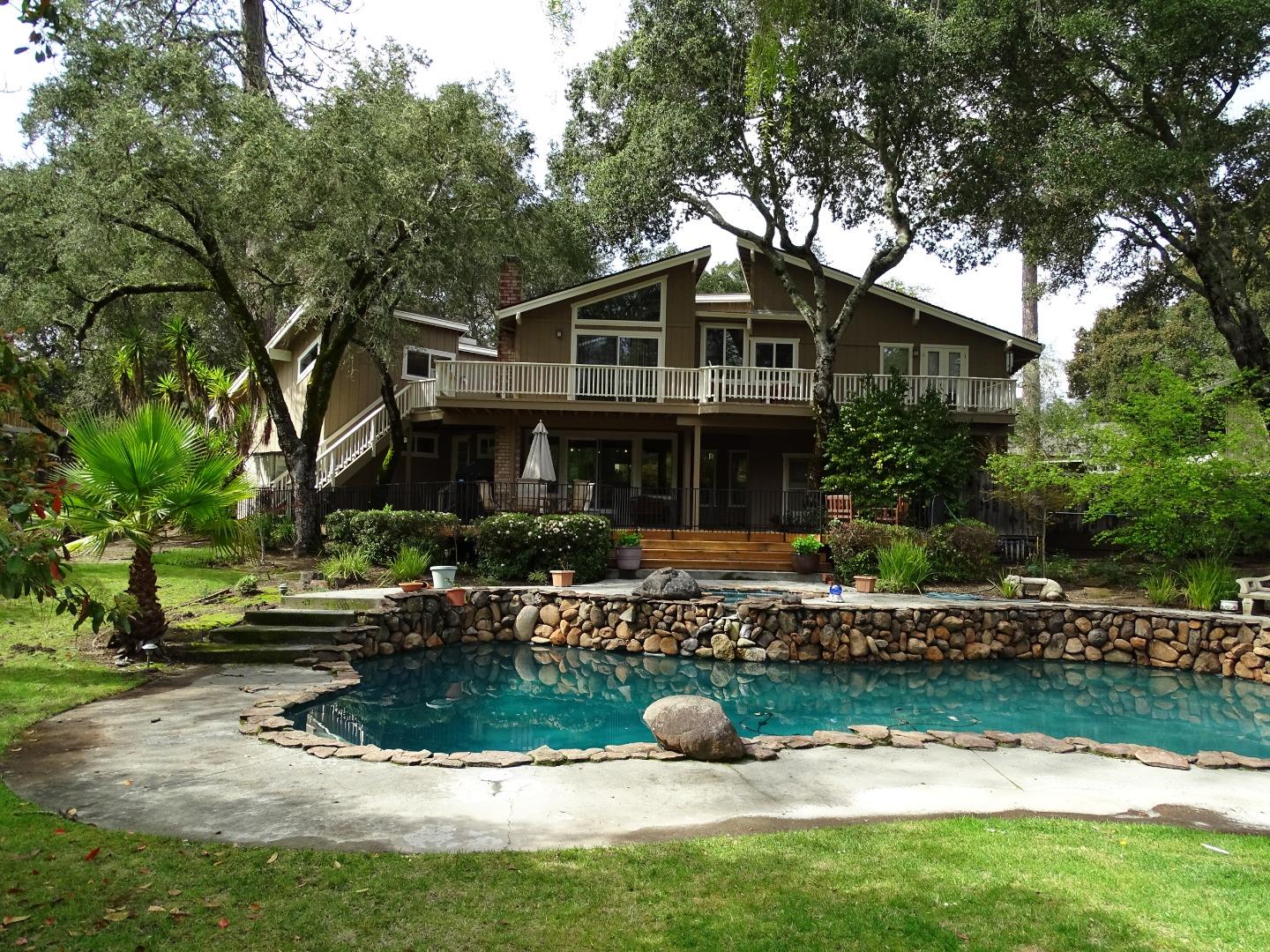 661 Sugar Pine Road Scotts Valley, CA 95066 - Photo 34 of 40 a front view of a house with a yard table and chairs