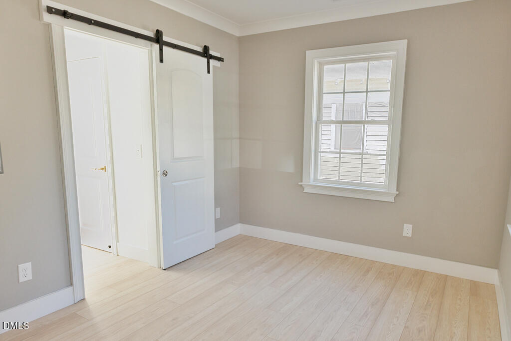 917 Gold Street North Wilson, NC 27893 - Photo 19 of 41 an empty room with windows and closet