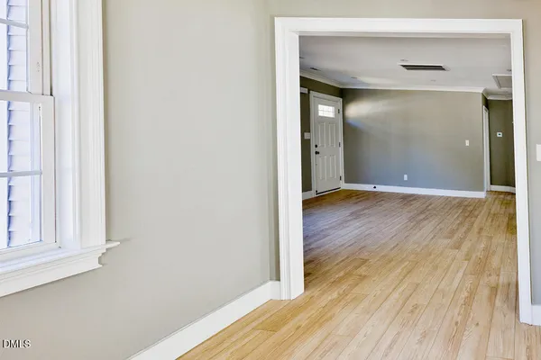 a view of a bathroom from a corridor