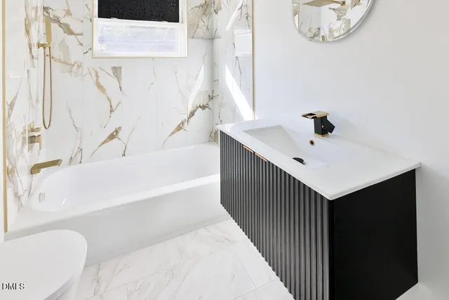 a bathroom with a bathtub and a shower