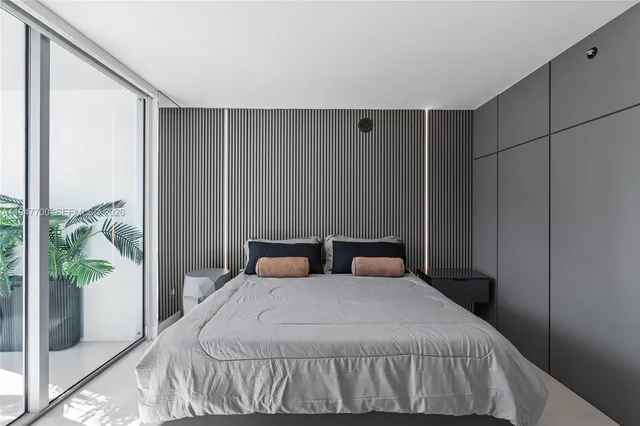 a bedroom with a bed and window