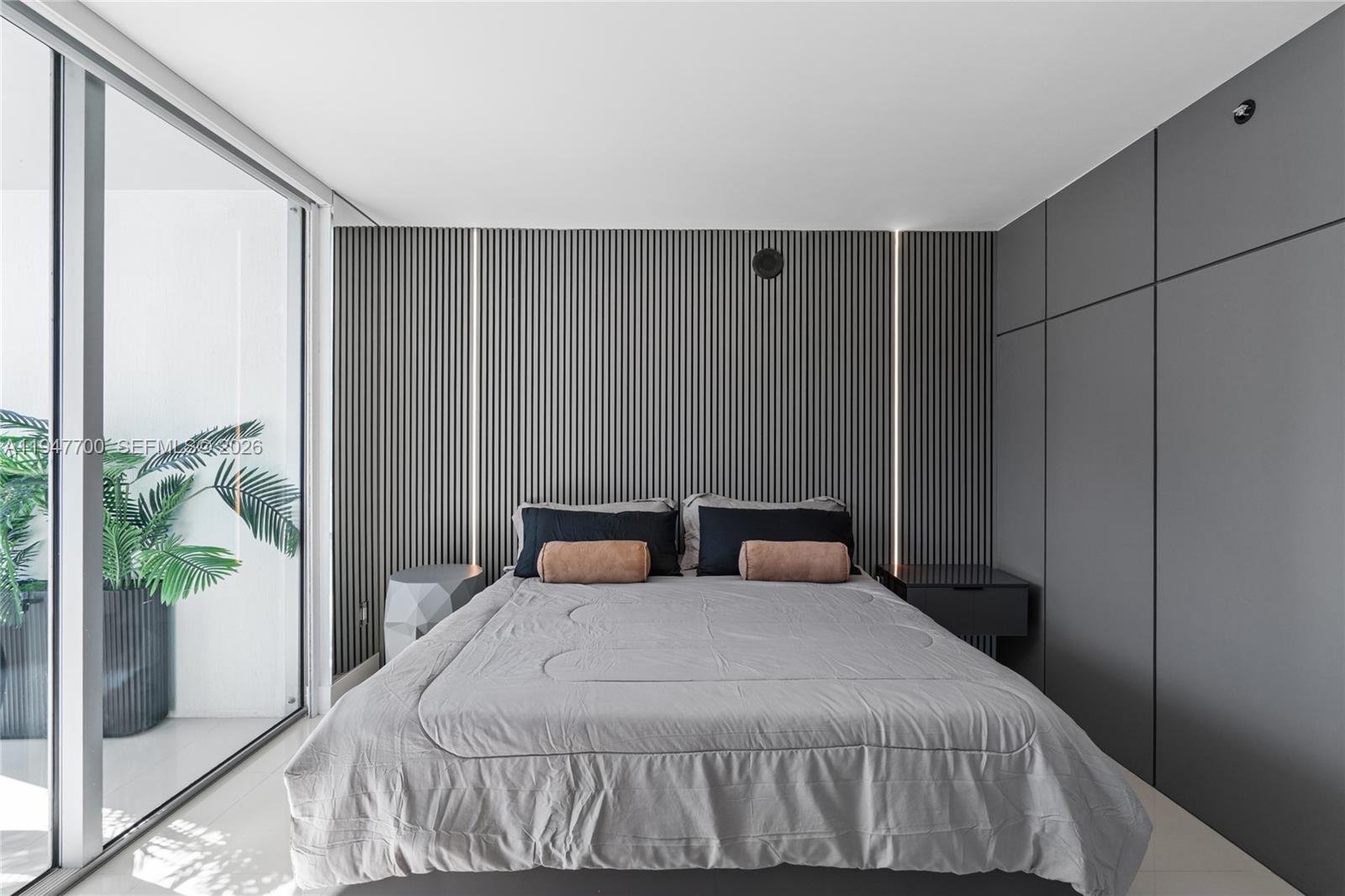 90 Southwest 3rd Street, Unit 2204 Miami, FL 33130 - Photo 19 of 51 a bedroom with a bed and window