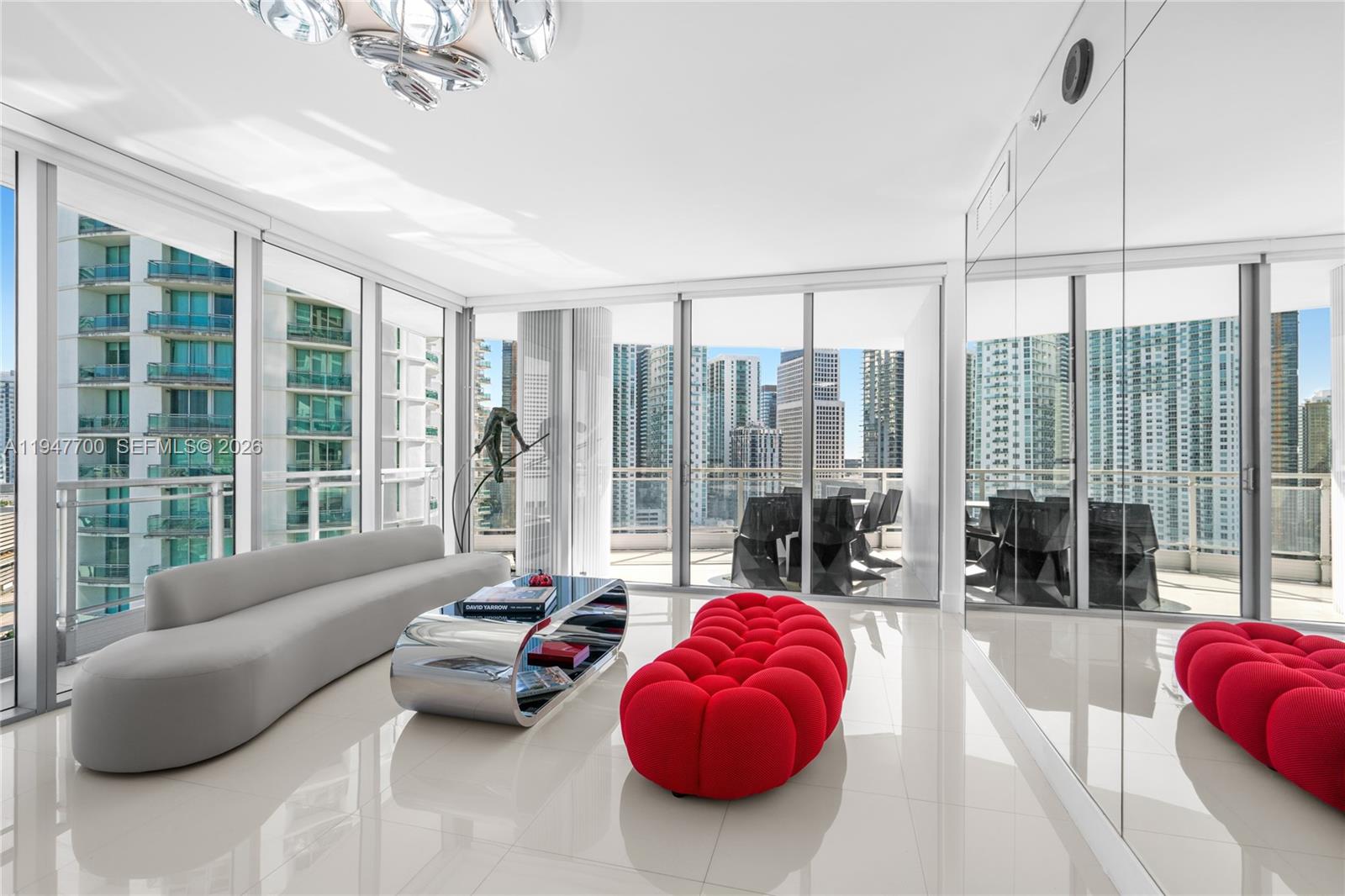 90 Southwest 3rd Street, Unit 2204 Miami, FL 33130 - Photo 2 of 51 a living room with furniture and a floor to ceiling window