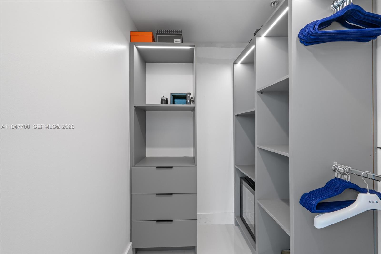 90 Southwest 3rd Street, Unit 2204 Miami, FL 33130 - Photo 25 of 51 a view of walk in closet with clothes and shoes