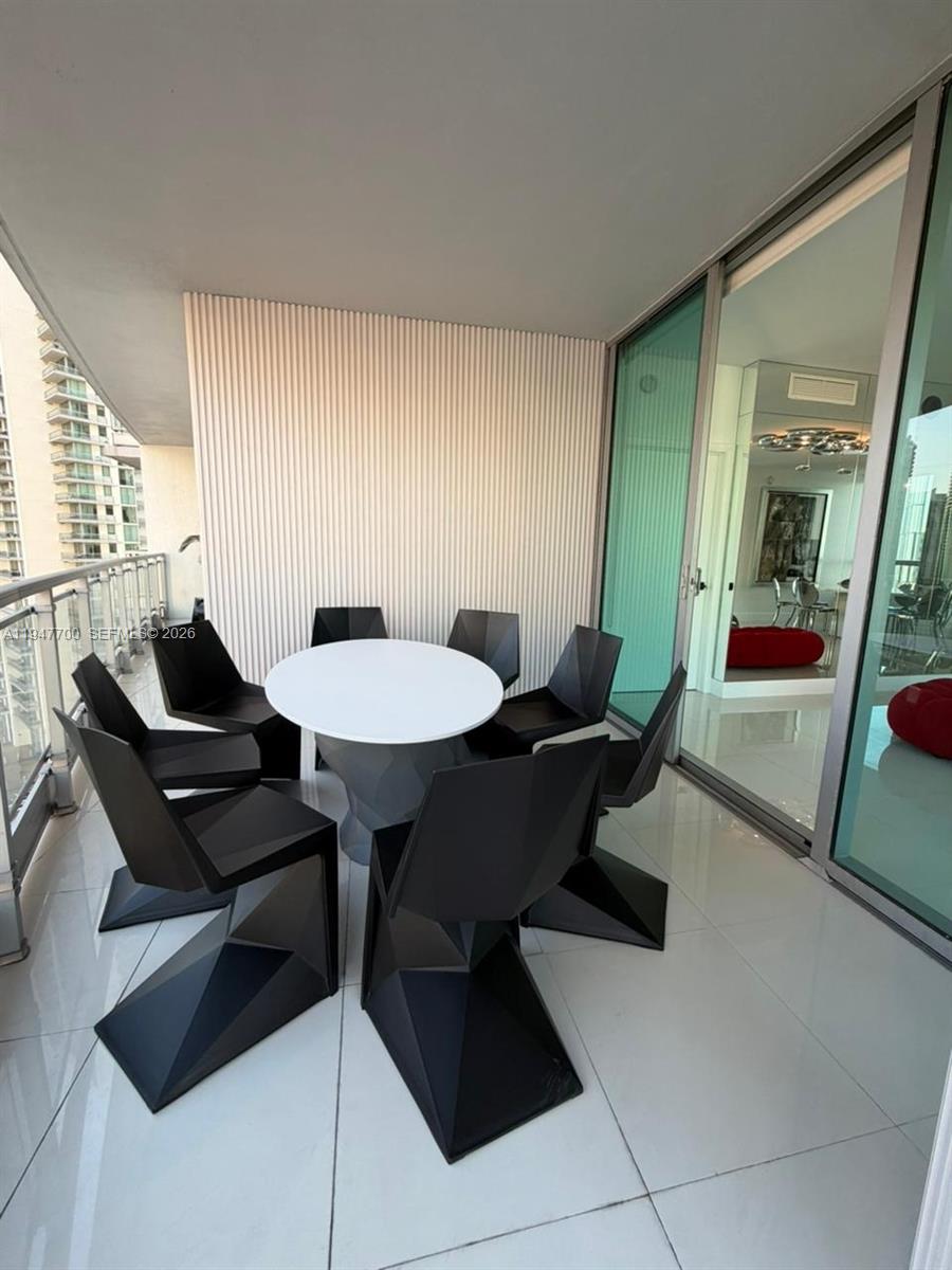 90 Southwest 3rd Street, Unit 2204 Miami, FL 33130 - Photo 48 of 51 a living room with furniture and a table