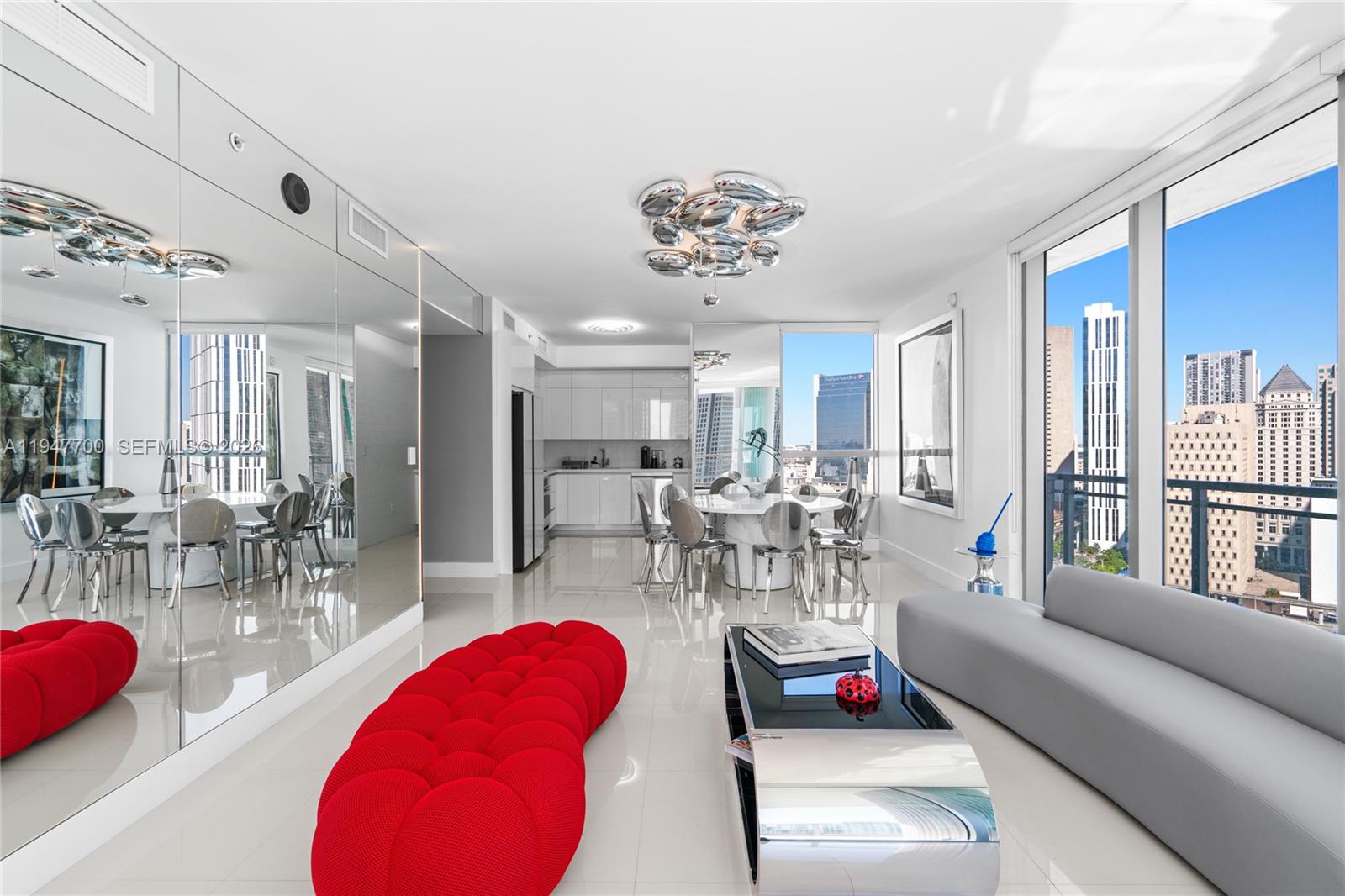 90 Southwest 3rd Street, Unit 2204 Miami, FL 33130 - Photo 5 of 51 a living room with furniture a table and chairs