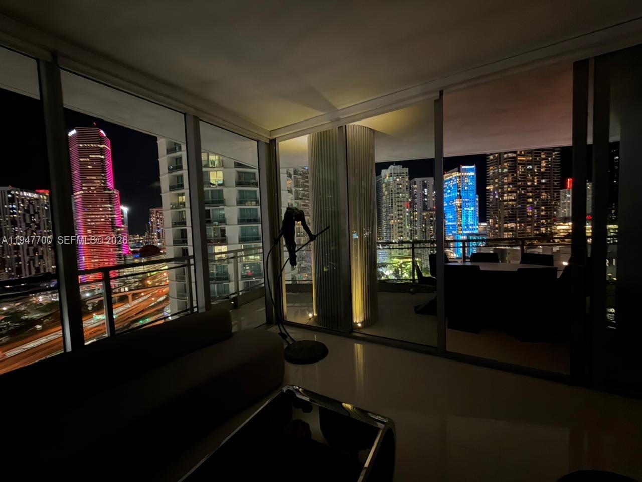 90 Southwest 3rd Street, Unit 2204 Miami, FL 33130 - Photo 51 of 51 a room with lots of people furniture and a window