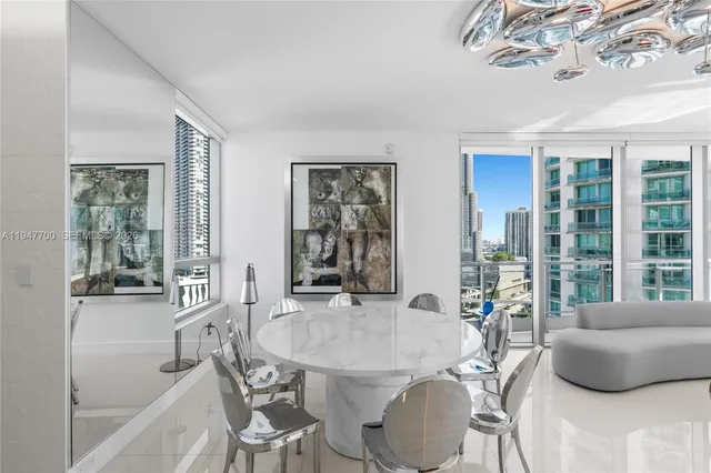 a dining room with furniture and window