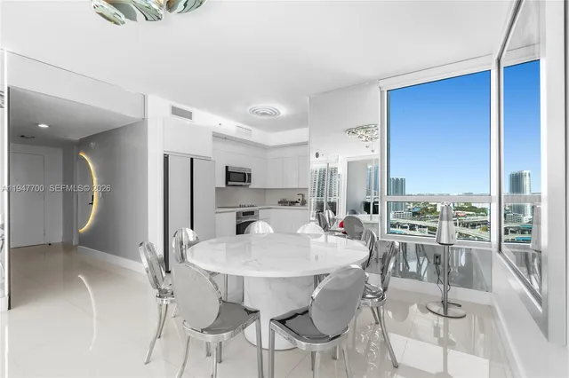 a view of a dining room with furniture window and outside view