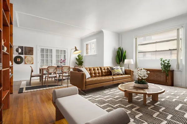 a living room with furniture and a table
