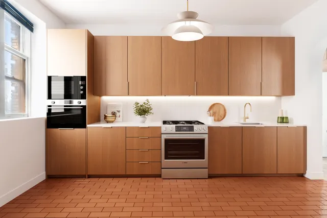 a kitchen with kitchen island a stove top oven a sink and dishwasher