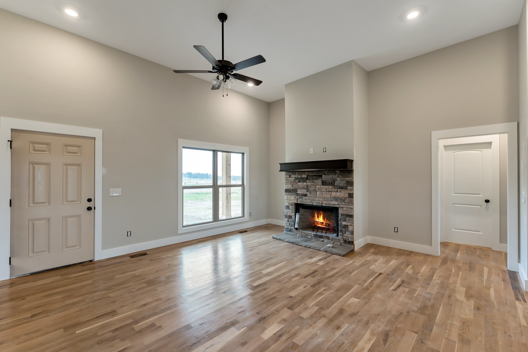 4901 Barren Plains Road Springfield, TN 37172 - Photo 3 of 15 a view of an empty room with wooden floor fireplace and a window