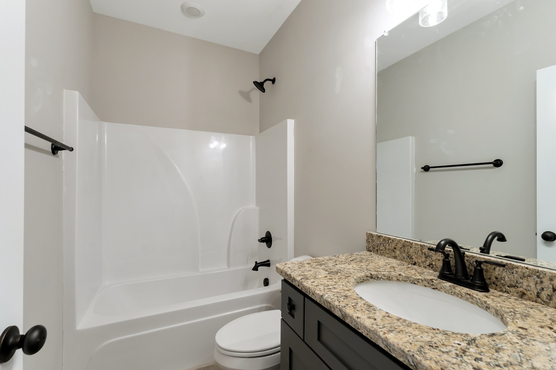 4901 Barren Plains Road Springfield, TN 37172 - Photo 8 of 15 a bathroom with a granite countertop sink a toilet and shower