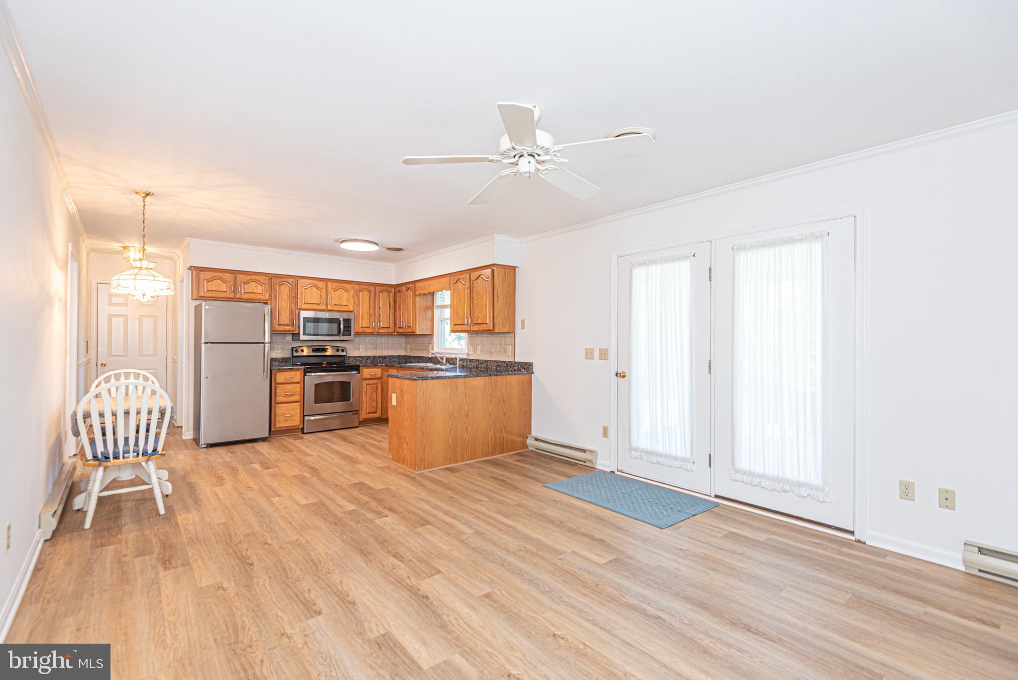 38241 Marlington Road Ocean View, DE 19970 - Photo 12 of 40 a view of kitchen with wooden floor